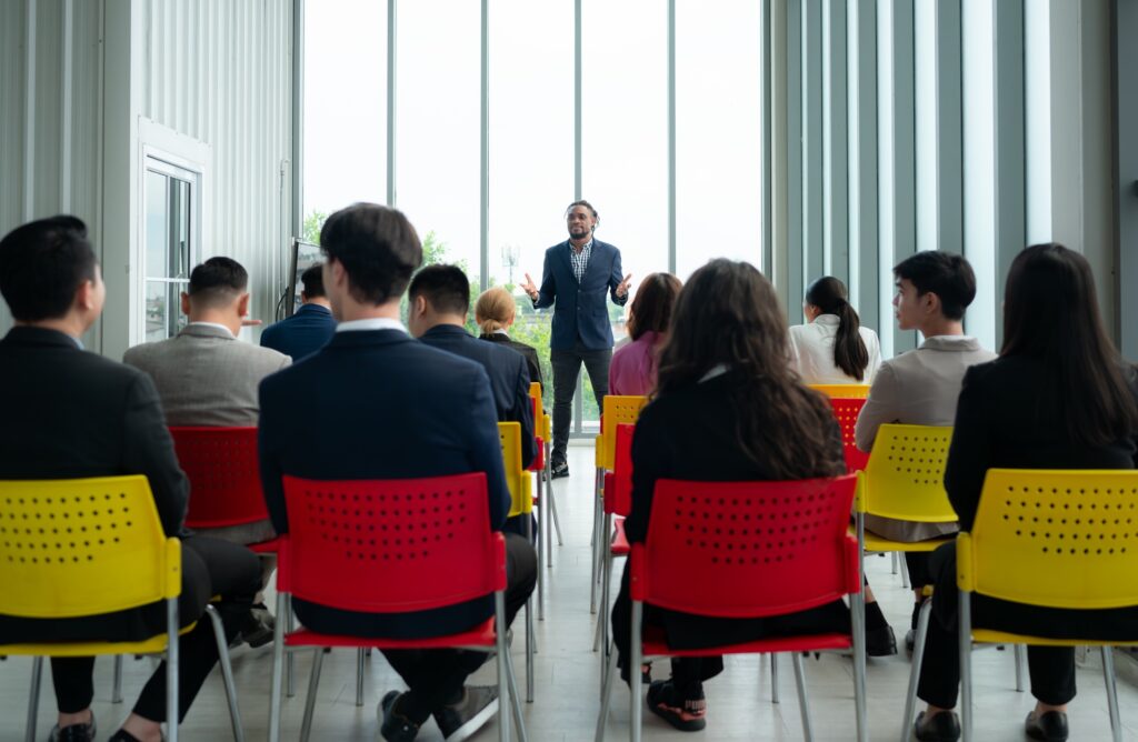 A group of business people organizes a seminar. Discuss the success of doing business
